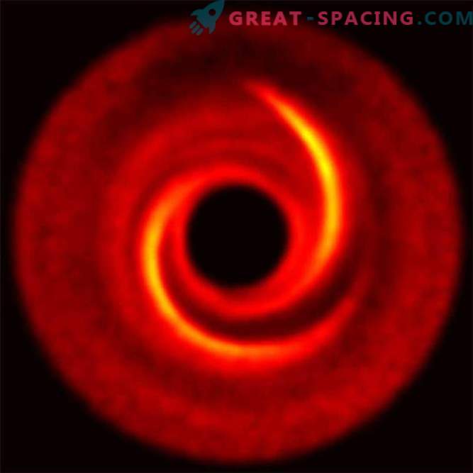 Strange spiral arms may hide emerging planets