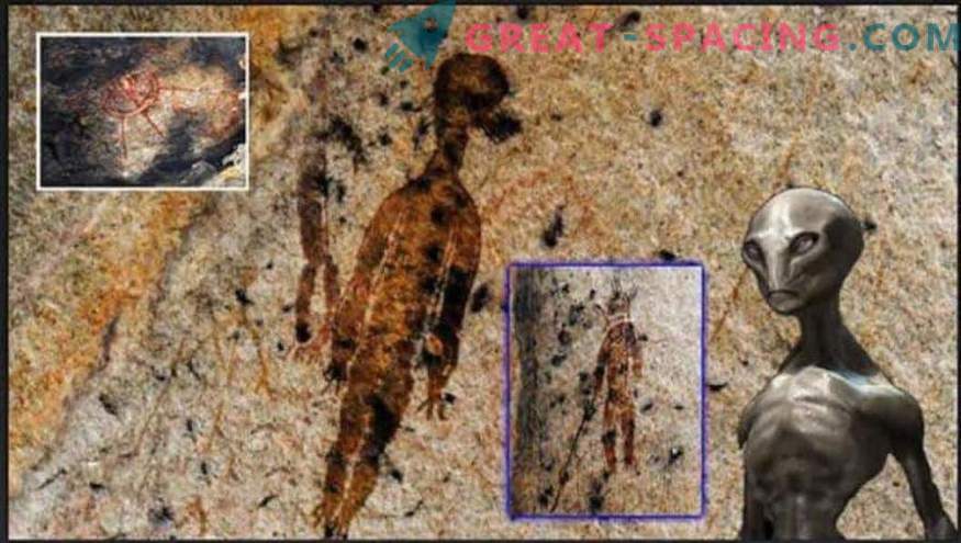 What kind of creatures are depicted on a 10,000-year-old cave figure