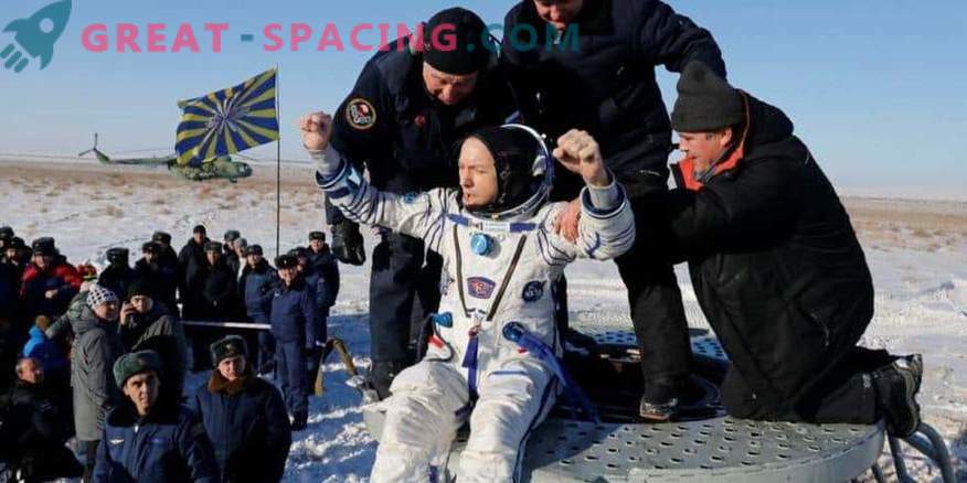 The space capsule returns crew members to Earth
