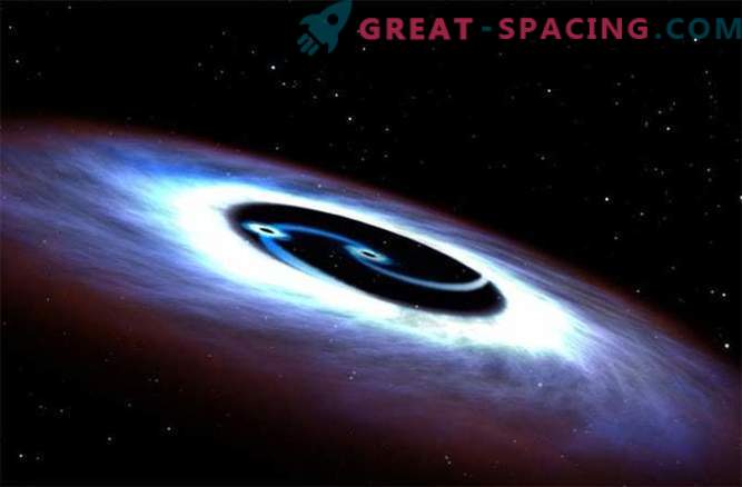 Black holes revolve around a quasar in a deadly battle